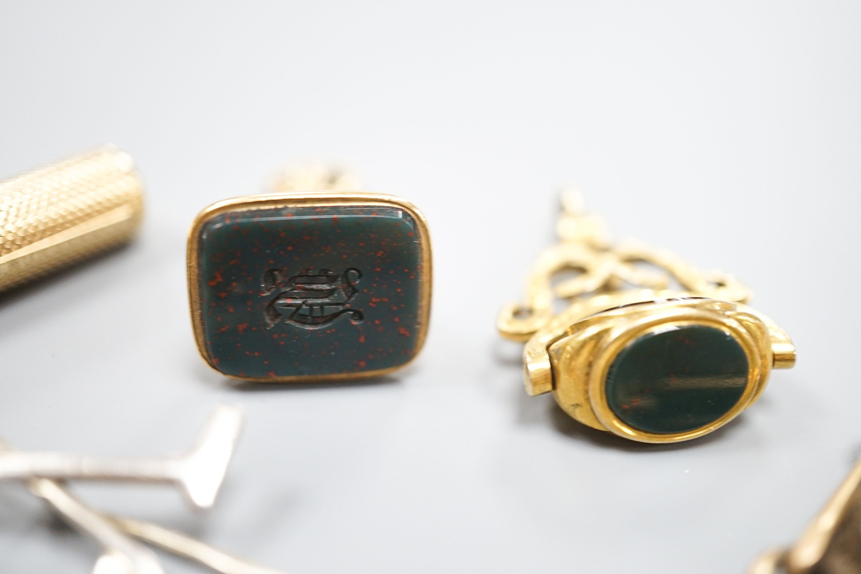 A yellow metal, chalcedony and gem set spinning fob seal, two other fob seal including agate and six other items including a Sampson Mordan & Co propelling pencil (a.f.).